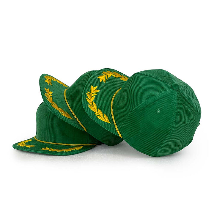Green cap with gold laurel wreath design on a white background
